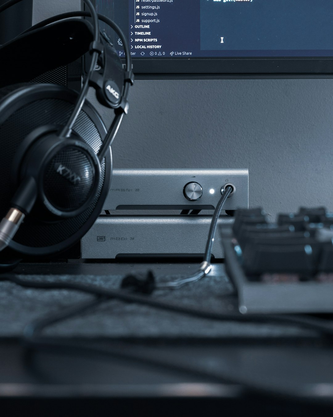 black-and-gray-headphones-on-gray-computer-tower-tioyudlemjg